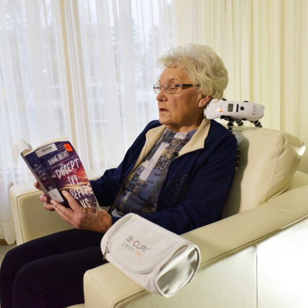 B cure Laser Pro Device Being Used for Neck Pain Relief at Home   B cure Laser
